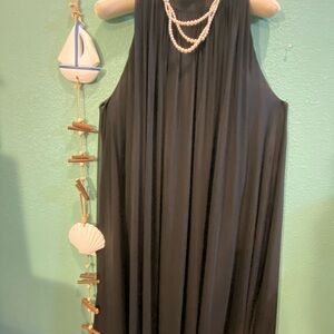 Fresh black fabric dress with bow and ribbons on neck for a bow